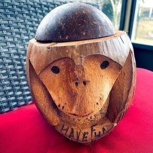 Hand-carved coconut shell monkey coin bank